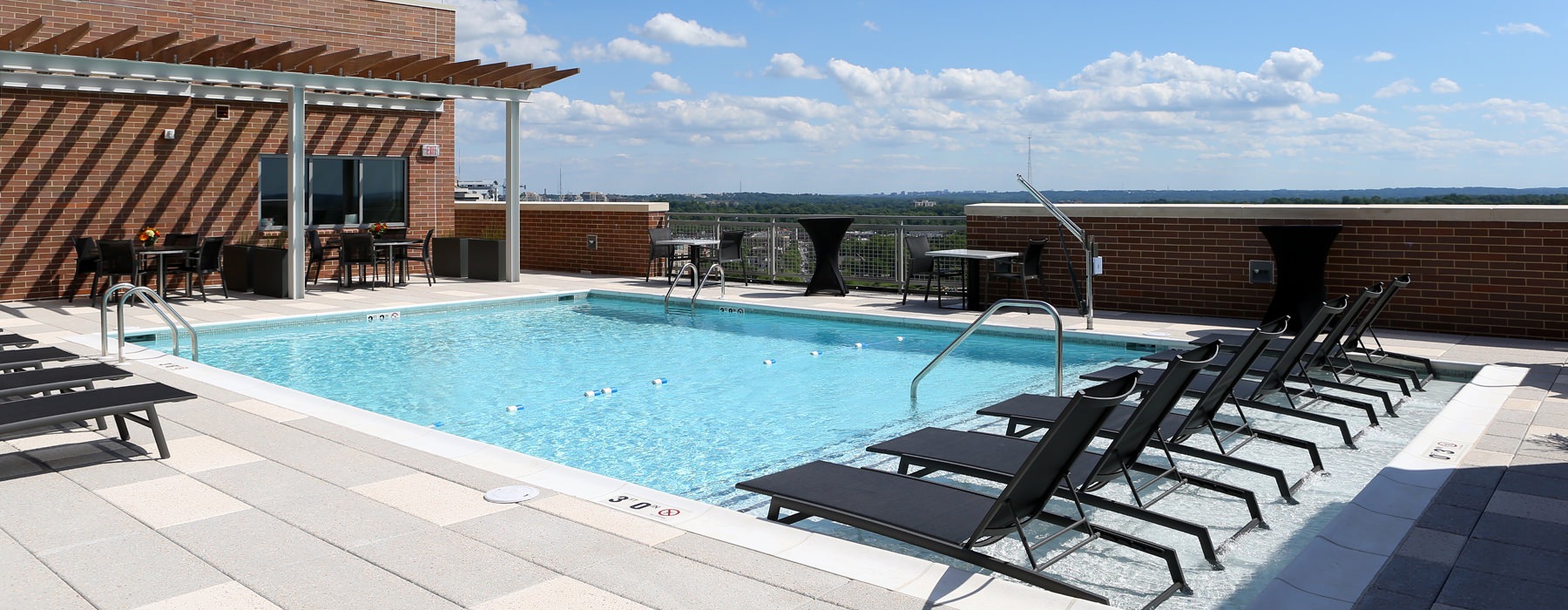 outdoor, rooftop pool with in-pool loungers