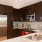 well lit, c-shaped kitchen open to living areas